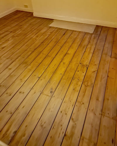 Replacing damaged wood floor planks - after