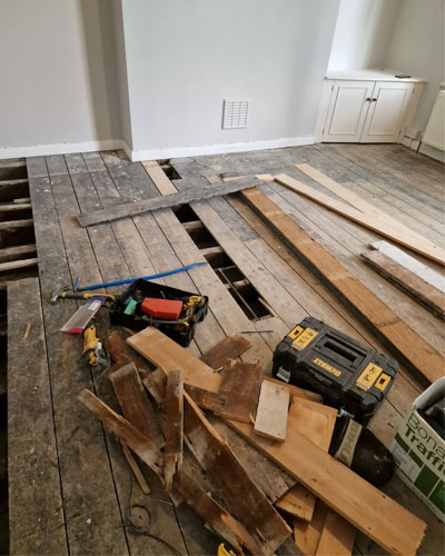 Replacing damaged wood floor planks - before