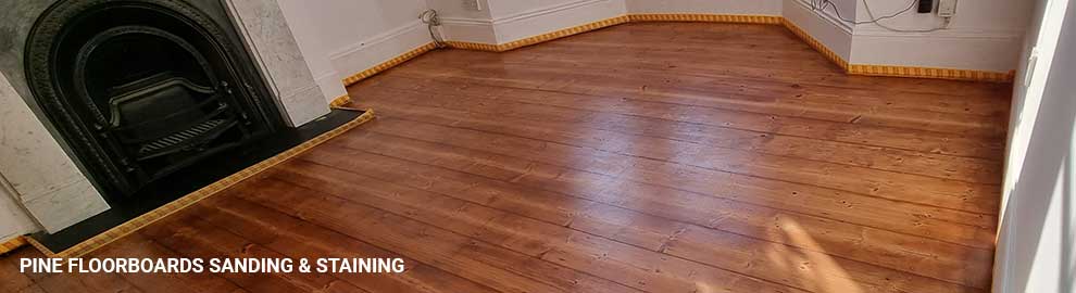 Pine floorboards sanding and staining