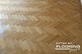Parquet flooring fitted in herringbone pattern
