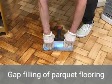Gap filling of parquet flooring