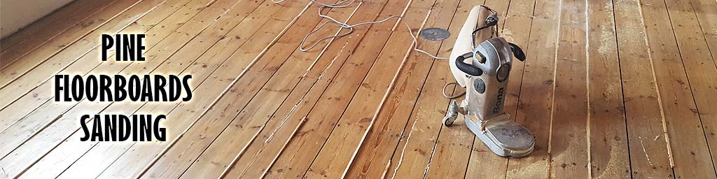 The sanding of pine floorboards
