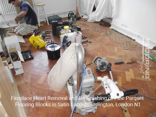 Fireplace heart removal and refinishing of pine parquet flooring blocks in satin lacquer in Islington