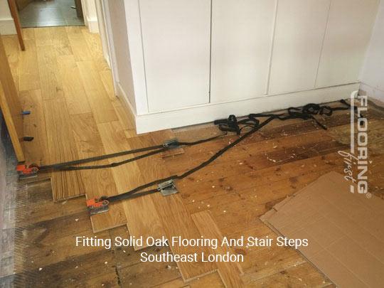 Fitting solid oak flooring and Stair steps in Southeast London