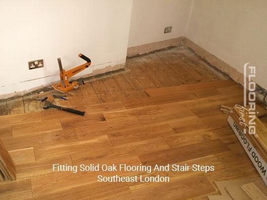 Fitting solid oak flooring and Stair steps in Southeast London 1