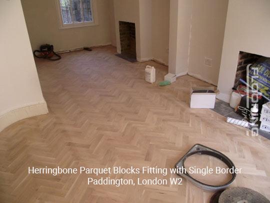 Herringbone parquet blocks fitting with single border in Paddington