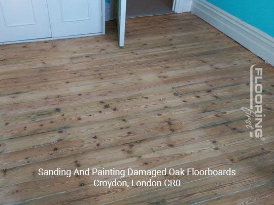 Sanding and painting damaged oak floorboards in London Borough of Croydon