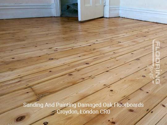 Sanding and painting damaged oak floorboards in London Borough of Croydon 2