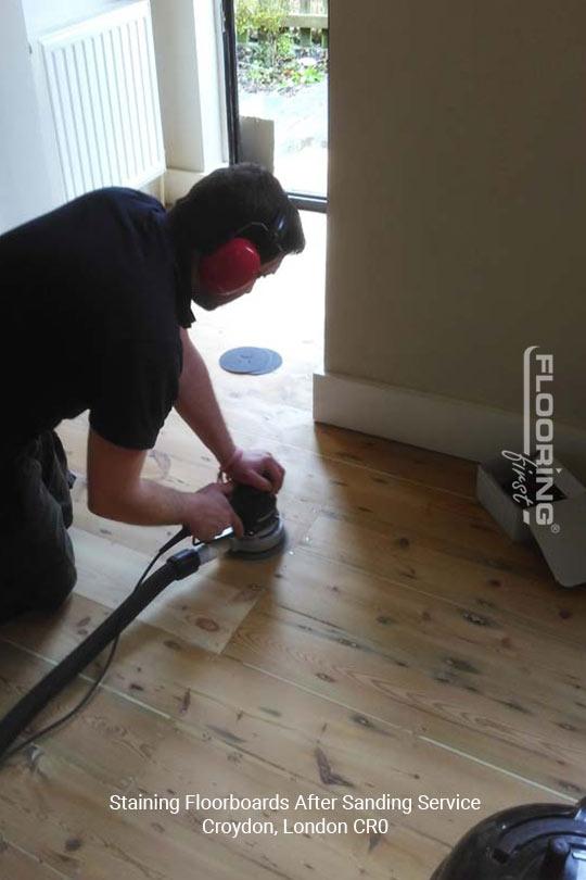 Staining floorboards after sanding service in Croydon 1