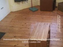 Distressed pine floorboards sanding and refinishing project in Enfield 1