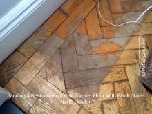 Sanding & restoration of oak parquet floor with black stains in North London