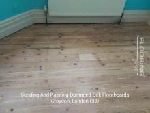 Sanding and painting damaged oak floorboards in London Borough of Croydon 1