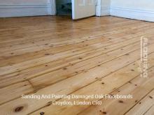 Sanding and painting damaged oak floorboards in London Borough of Croydon 2