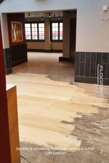 Pub sanding and varnishing solid oak flooring in East London 1