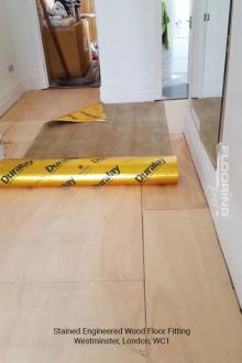 Stained engineered wood floor fitting in Westminster 2