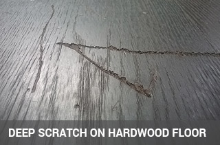 Deep scratch on hardwood floor