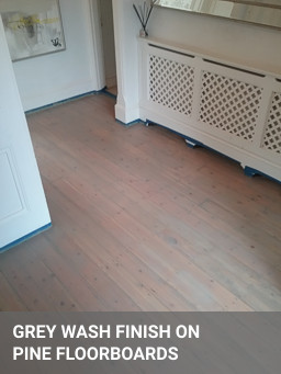 Grey wash finish on pine floorboards