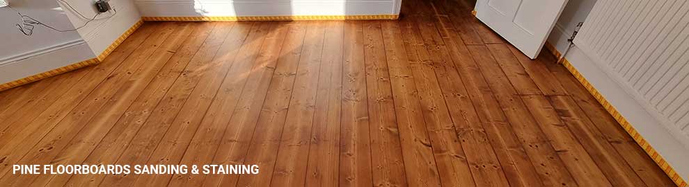 Pine floorboards sanding and staining