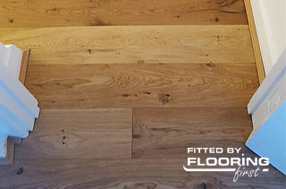 Hardwood floor fitted after door frames trimming