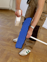cleaning a wooden floor with specially designed product
