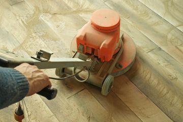 Use a big sanding machine or an edger first