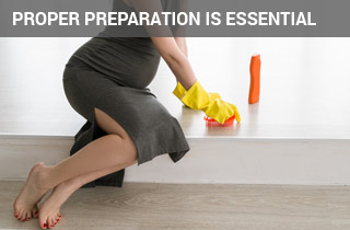 Pregnant woman cleaning a floor