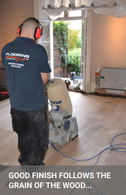 Wood floor sanding - sanding hardwood flooring with Bona belt machine